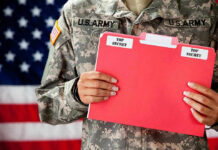 Airman Turned Traitor? $200K Reward for Runaway Spy U.S. Army soldier holds a Top Secret folder.