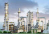 Drone Mayhem: Moscow’s Defenses Shattered Industrial plant with metal towers and pipes.