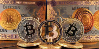 Bitcoin coins and bills displayed closely.
