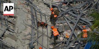 Building under construction in Philippines collapses, leaving 1 dead and 21 trapped