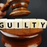 Outrageous Medicare Fraud: NFL Player Sentenced A gavel striking down next to wooden blocks spelling 'GUILTY'