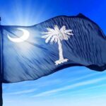 High-Stakes Retrial: Murdaugh Case in Turmoil South Carolina state flag waving against a blue sky