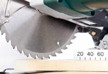 Close-up of a circular saw blade cutting through a piece of wood