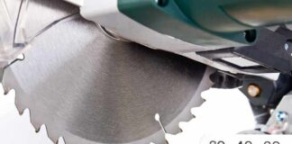 Close-up of a circular saw blade cutting through a piece of wood