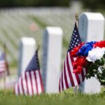 Arlington’s Secret: 260K Flags in Hours American flags and flowers placed at graves in a cemetery