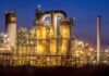 Toxic Tank Crisis—50,000 Evacuate Danger Zone An industrial facility with illuminated structures at night