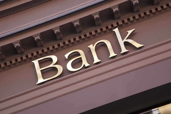 shutterstock_240120346 Close-up of a bank sign with gold lettering