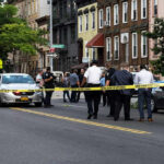 Motorcycle Mayhem In Central Park — Why No Charges? Police gathered at an urban crime scene.