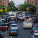 Subway Terror Near Penn Station Police activity on a city street with emergency vehicles.