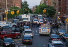 Subway Terror Near Penn Station Police activity on a city street with emergency vehicles.