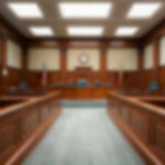 Track Meet Turns Deadly—Verdict Stuns Empty courthouse courtroom with wooden benches and chairs.