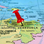 Red pin on Venezuela, South America map.