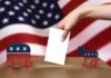 Feds Grab Voter Files — What’s Hidden? A hand placing a ballot into a box with political symbols on either side against a backdrop of the American flag