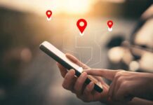 Supreme Court Slaps Digital Dragnets Person using a smartphone with location markers displayed on the screen