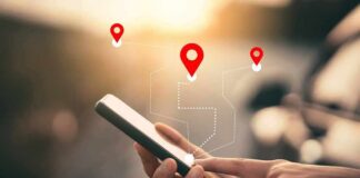 Person using a smartphone with location markers displayed on the screen