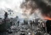 Record Barrage Slams Ukraine A chaotic protest scene with smoke, fire, and people holding flags