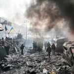 A chaotic protest scene with smoke, fire, and people holding flags