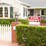 Housing Sticker Shock Tied to Biden Border Surge A house with a For Rent sign in the front yard