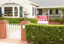 Housing Sticker Shock Tied to Biden Border Surge A house with a For Rent sign in the front yard