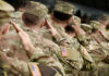 Army Captain’s Chilling Abortion Plot Soldiers in camouflage uniforms saluting in formation outdoors