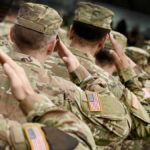 Army Captain’s Chilling Abortion Plot Soldiers in camouflage uniforms saluting in formation outdoors