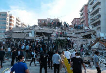 Buried Eight Days—He Still Walked Out People at a collapsed building after an earthquake.