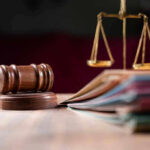 Obama Aide Entangled—“Uncle Jeffrey” Emails Judges gavel, scales of justice, and legal documents.