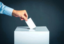 California Loophole: Sex Offenders Can Still Run Hand placing ballot into voting box.