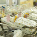 Billionaire Cash Hijacks Kids’ Futures? Newborn babies in a hospital nursery.