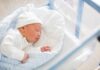 Vice President’s Welcomes Historic Baby Newborn baby sleeping in hospital bassinet
