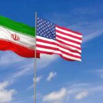 U.S. Hammers Iran Iran and United States flags waving on flagpoles