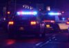 Motel Manager Banked On Children, Feds Say Police cars with flashing lights at a nighttime scene near a motel