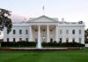 America-First Demands Hit Iraq Talks The White House with a fountain in the foreground and an American flag flying