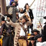 Group of pirates celebrating on a ship