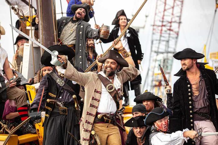 shutterstock_2079154843 Group of pirates celebrating on a ship
