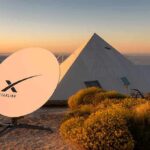 SpaceX’s Orbital AI Gambit Alarms Engineers Starlink satellite dish near a pyramid-shaped building at sunset