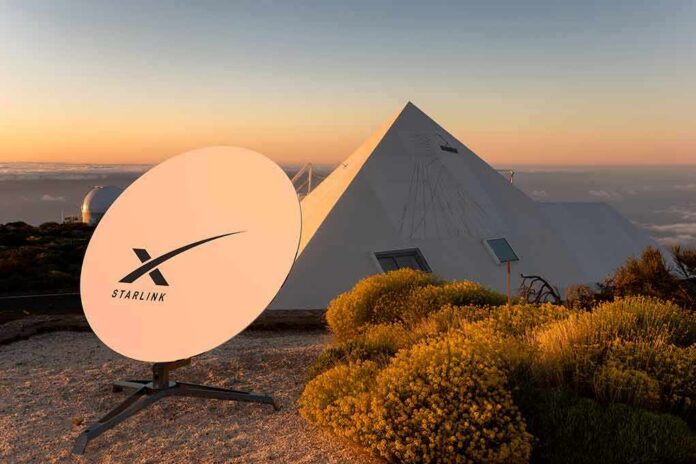 Starlink satellite dish near a pyramid-shaped building at sunset
