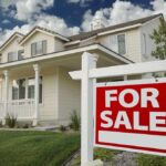 Hidden Landlords Jack Rents, Evict Faster A suburban house with a For Sale sign in the front yard