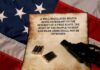 A revolver and bullets placed on an aged document with the Second Amendment text, set against an American flag background