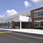 Fentanyl Chaos—Board Shrugs Off Testing Modern school building with large windows and a clear sky