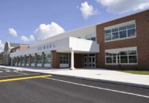 Fentanyl Chaos—Board Shrugs Off Testing Modern school building with large windows and a clear sky