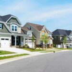Four Million Homes—Just Missing Suburban street with modern two-story houses