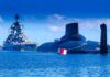 Strait Takeover? Trump Dangles Tolls A submarine and a warship in the ocean under a blue sky