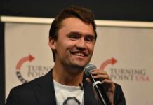 Kirk’s Prediction Haunts Hasan Today man speaking into a microphone on stage