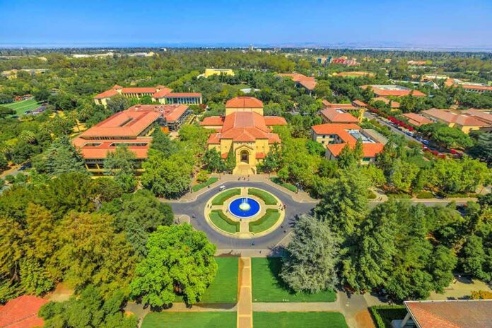 Aerial view of a university campus with central fountain and red-tiled buildings