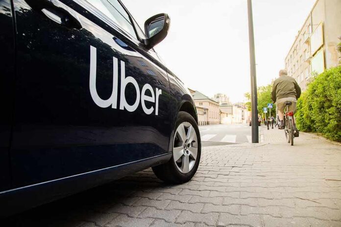 Uber-branded car parked on city street near cyclist