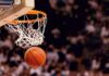 Basketball dropping through a hoop