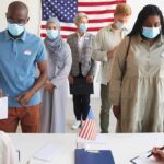 Republicans Torpedo Trump’s Election Crackdown Voters wearing masks stand in line at a polling station