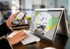Antitrust Bombshell Rocks Zillow, Redfin Person using phone and laptop with real estate map app
