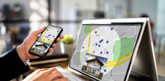 Person using phone and laptop with real estate map app